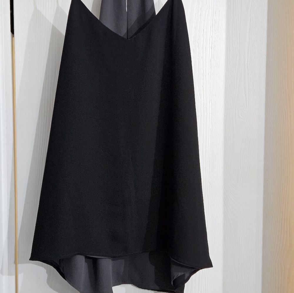 Women's top. Black with gray inside. Thin straps.